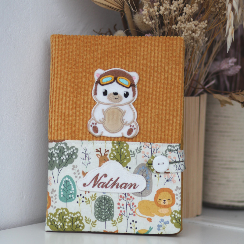 Carnet de santé ourson aviateur